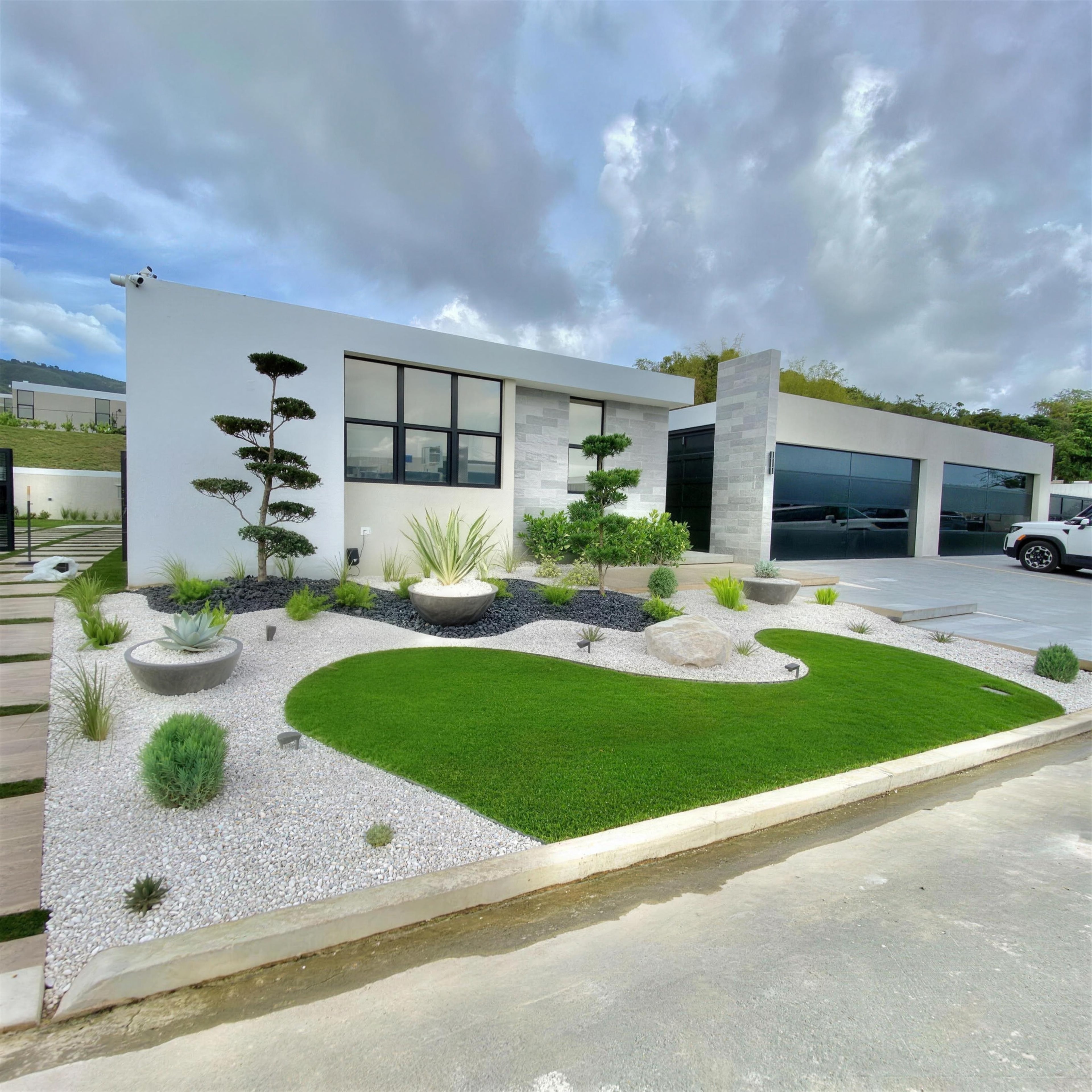 Daytime front yard with white gravel